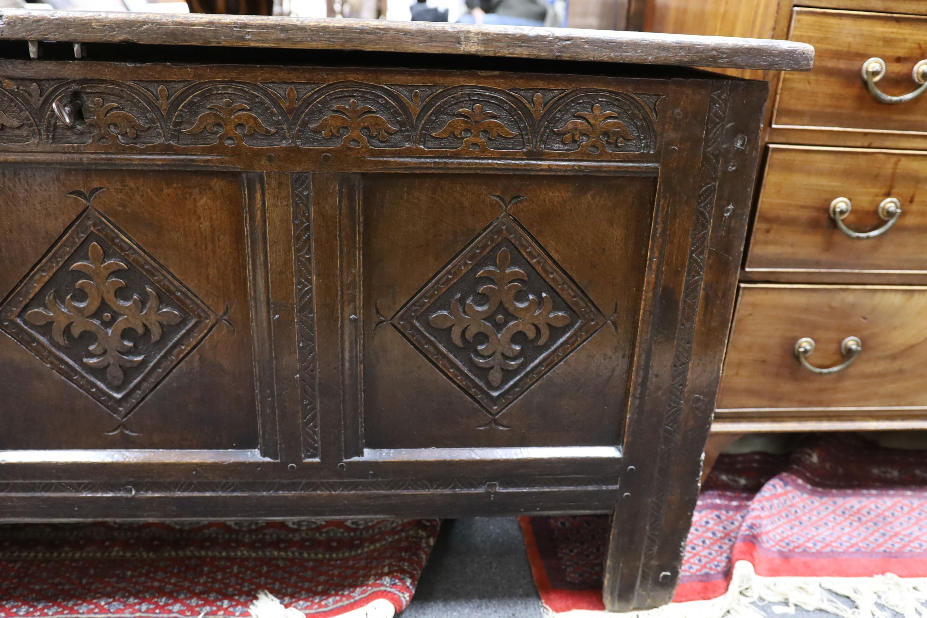 A late 17th century carved oak coffer, length 134cm, depth 54cm, height 68cm